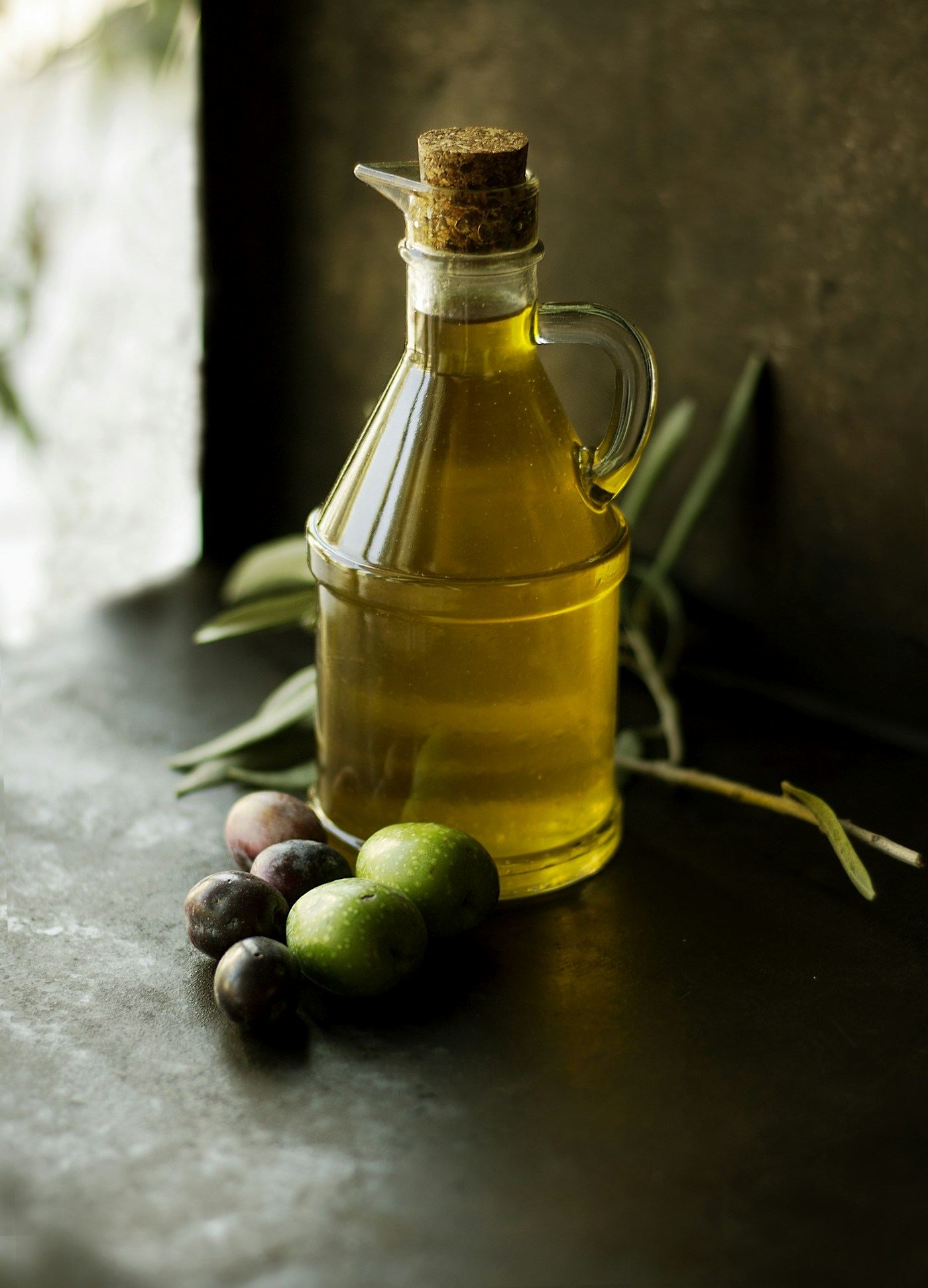 Fresh olives and olive oil